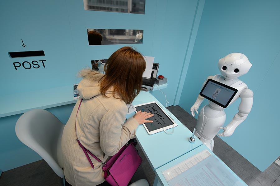 SoftBank staffs cell phone store with Pepper robots