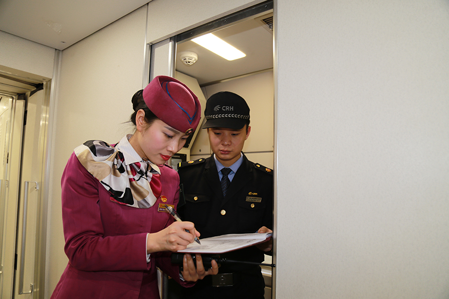 Attendants work in a standby bullet train