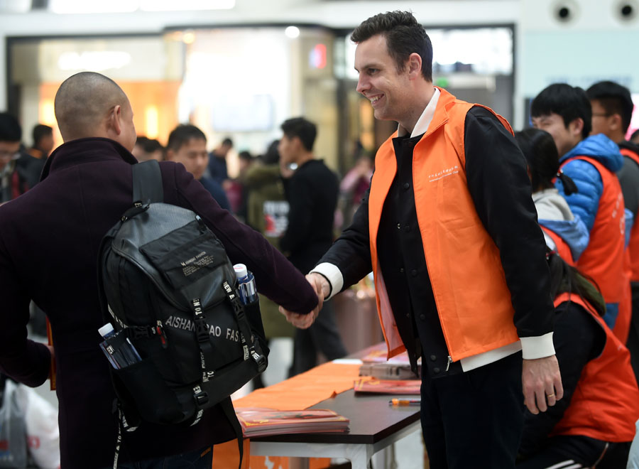 Offering holiday cheer during train station travel rush