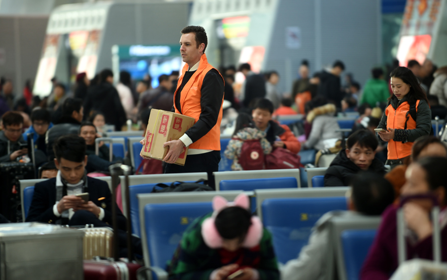 Offering holiday cheer during train station travel rush