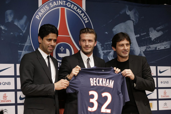 David Beckham arrives for a news conference in Paris