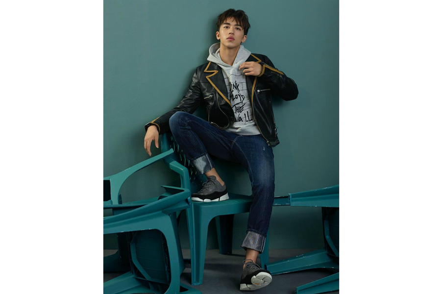 Actor Xu Weizhou poses for fashion magazine