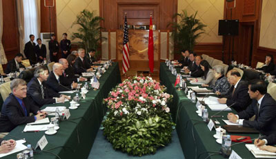 U.S. Treasury Secretary Henry Paulson (3rd L) meets Chinese Vice Premier Wu Yi (3rd R) during a meeting at Beijing airport March 7, 2007.