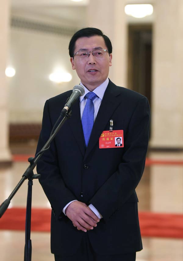 Delegates pick up questions at the Great Hall of the People