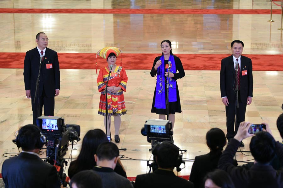 Delegates pick up questions at the Great Hall of the People