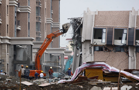 Demolition of collapsed building in Shanghai underway