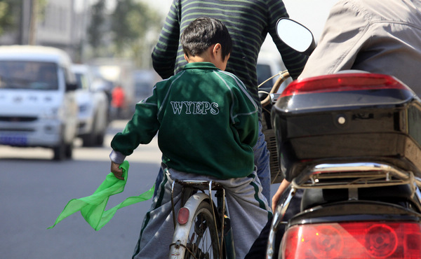 Parents see green scarves as humiliation to pupils