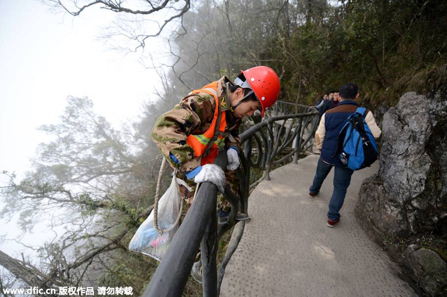 'Spider-men' janitors clean up mountain