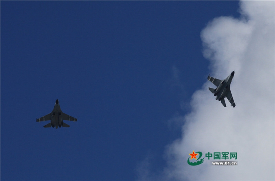 Naval aviation J-11 fighters conduct flight training