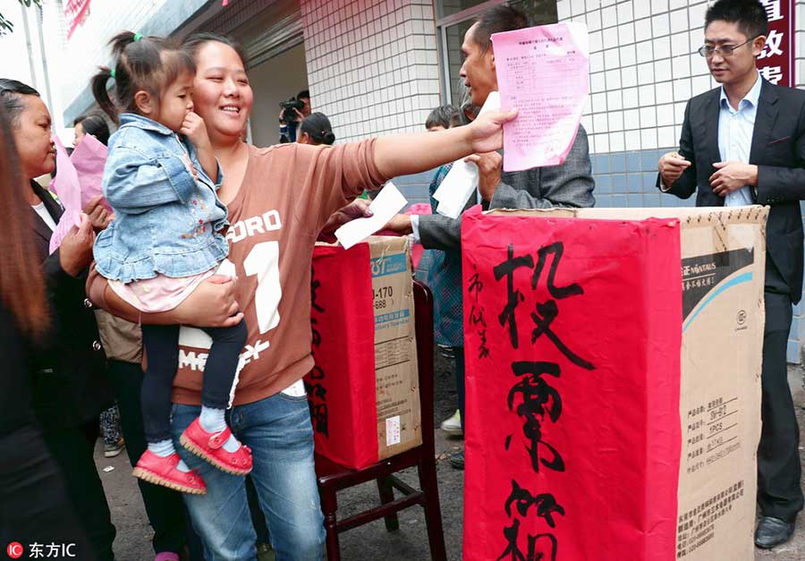 Xi casts vote for new lawmakers