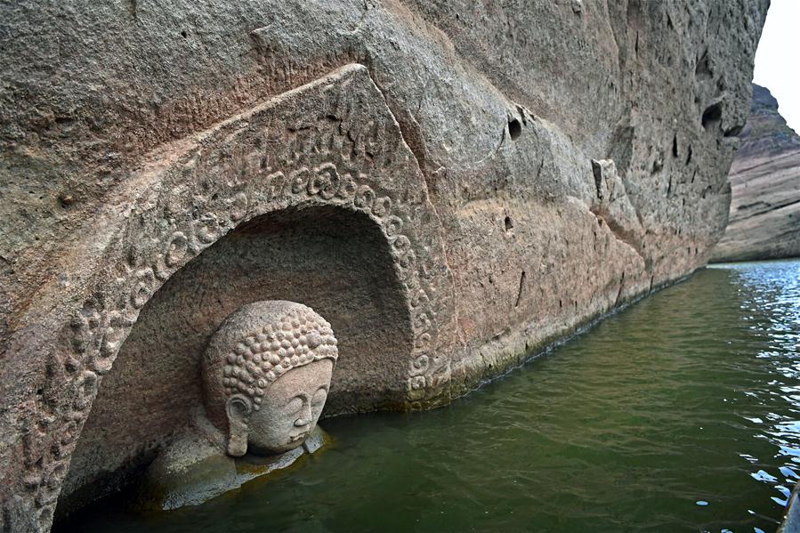 Ancient Buddha found as water level of reservoir lowers in E China