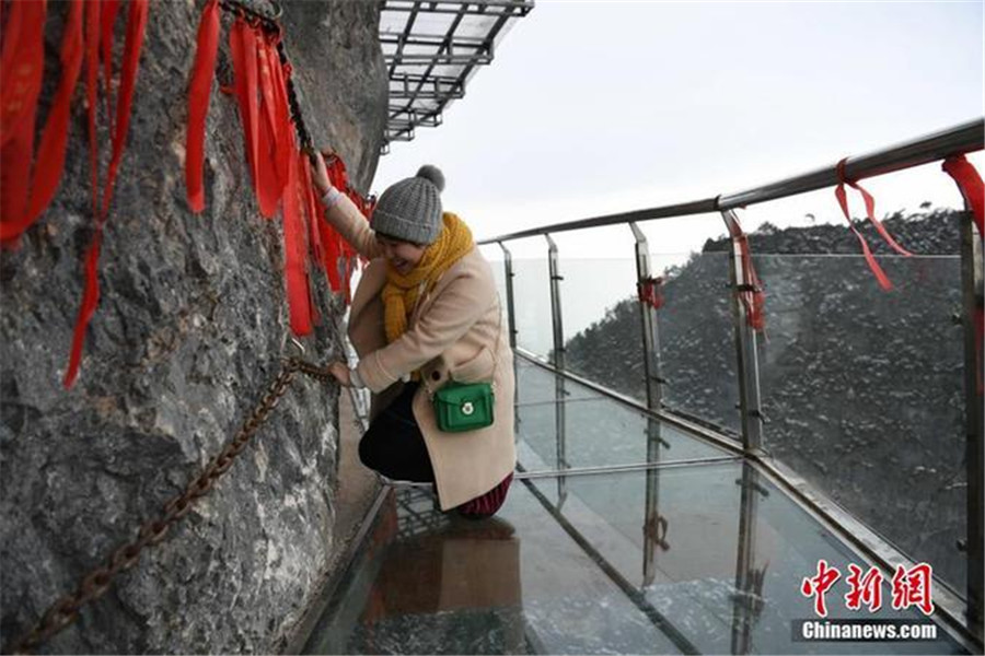 China's highest glass skywalk welcomes tourists