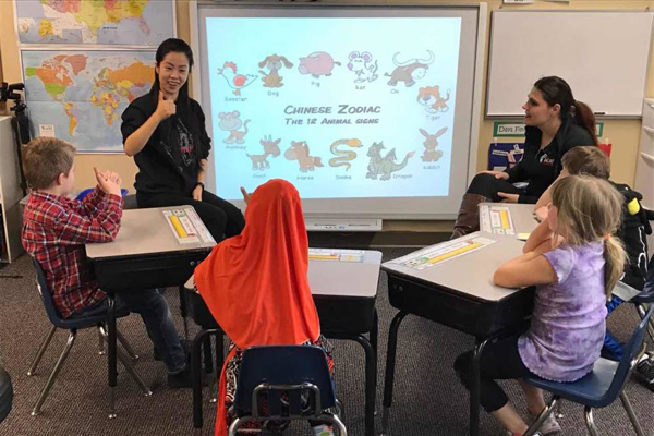 Deaf professor carries smiles across the Pacific