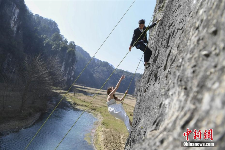 Taking love to new heights with special cliffside wedding photo