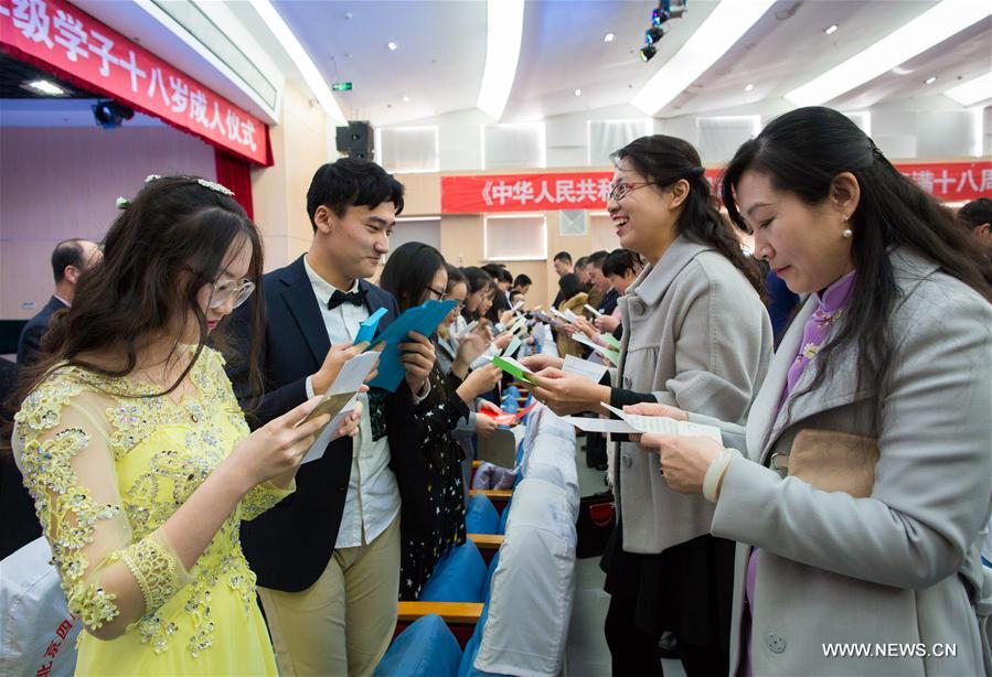 Students cheer at adult ceremony in North China