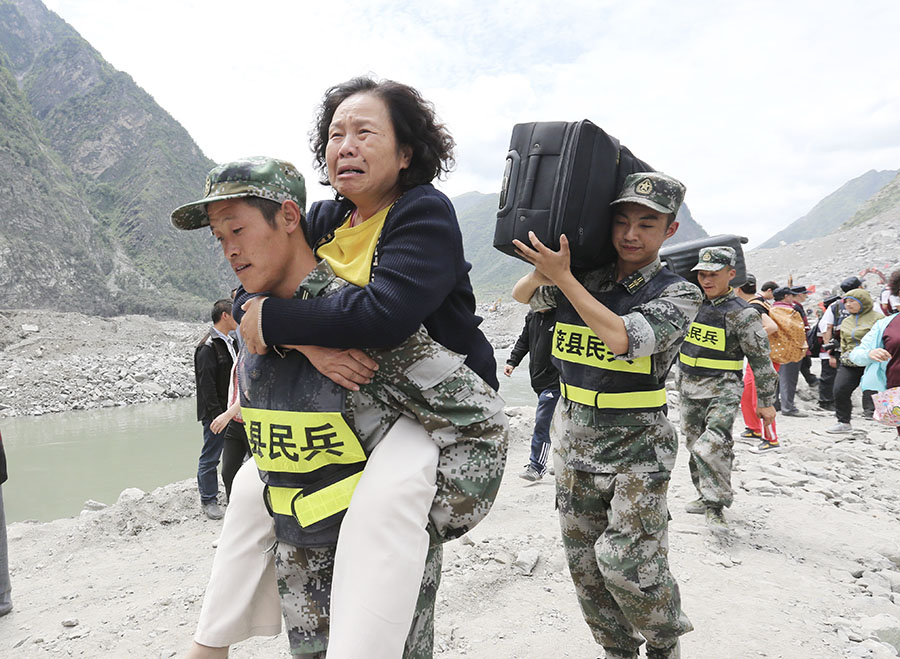 Rescue work underway after SW China's devastated landslide