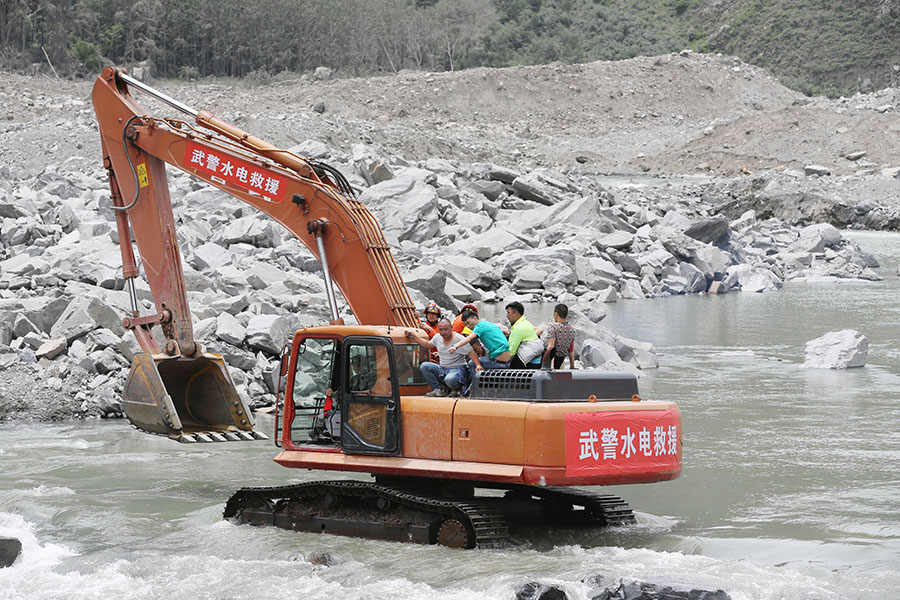 Rescue work underway after SW China's devastated landslide