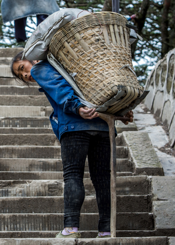 Laborer lifts heavy loads to build better life