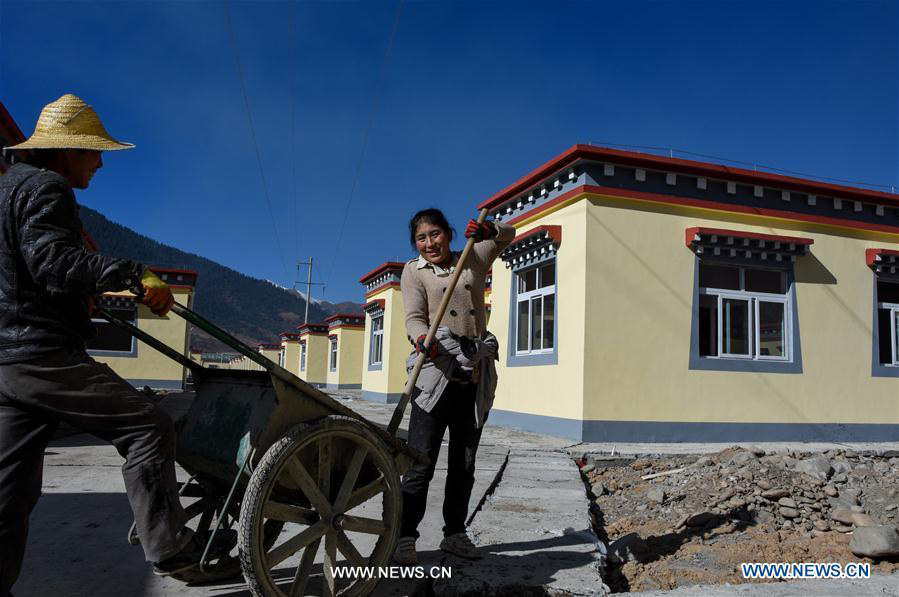 Impoverished villagers in China's Tibet move into new houses