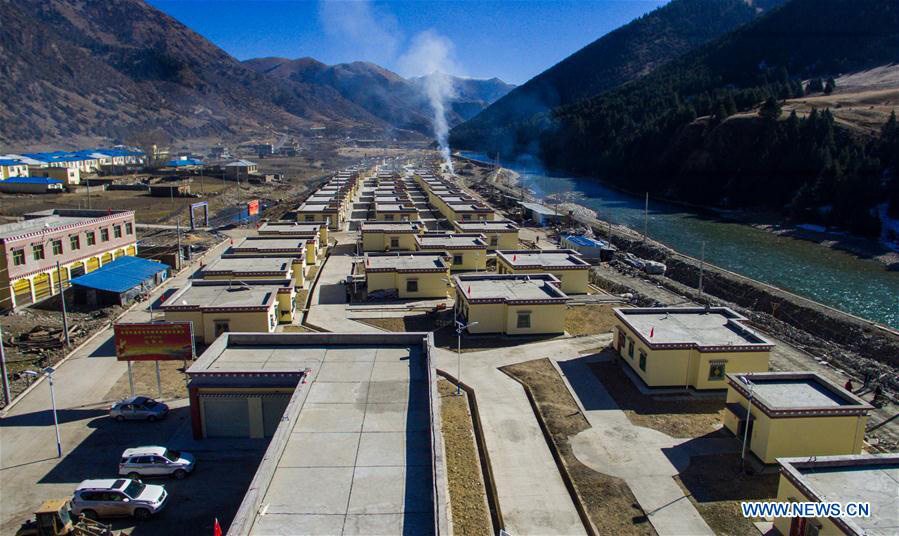 Impoverished villagers in China's Tibet move into new houses