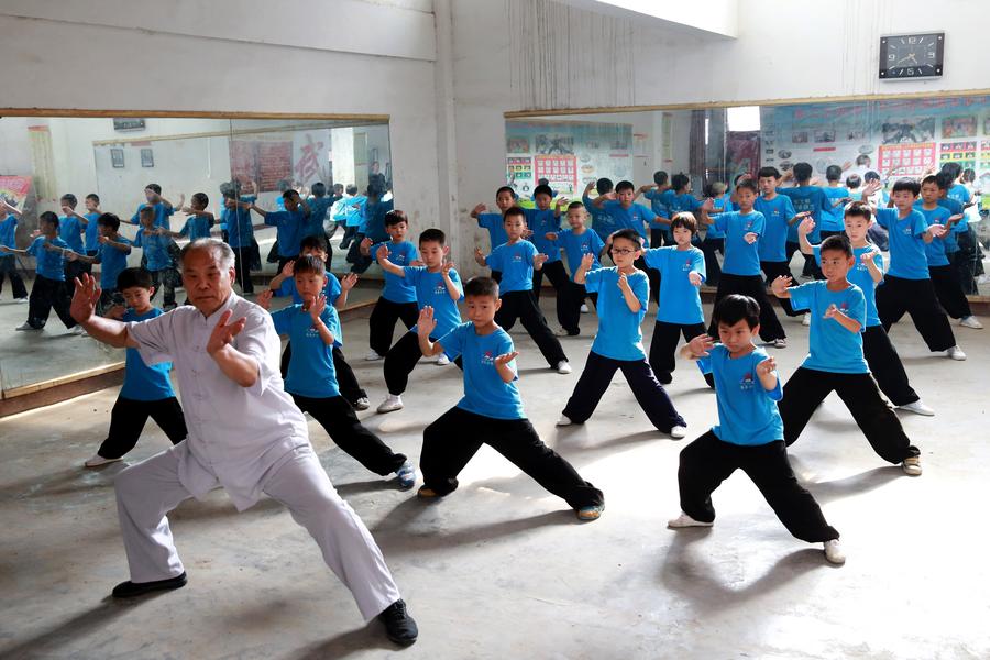 Students learn tai chi in Henan