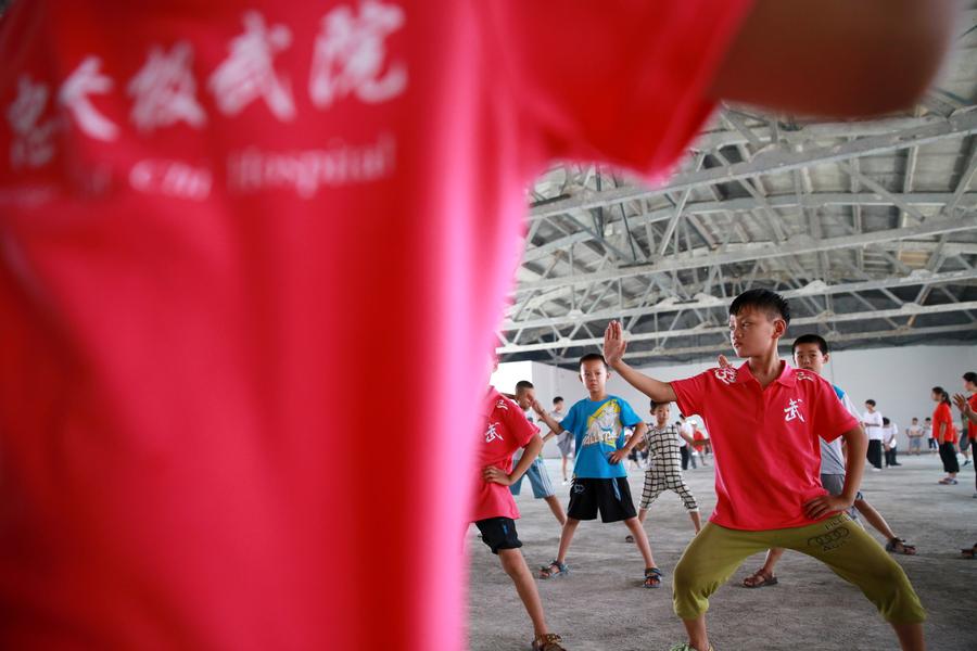 Students learn tai chi in Henan