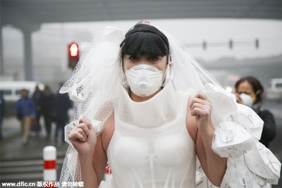 Artist appeals to public to combat smog with respirator wedding dress