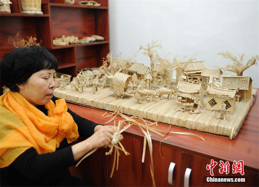 Straw artwork portrays ancient painting scenes