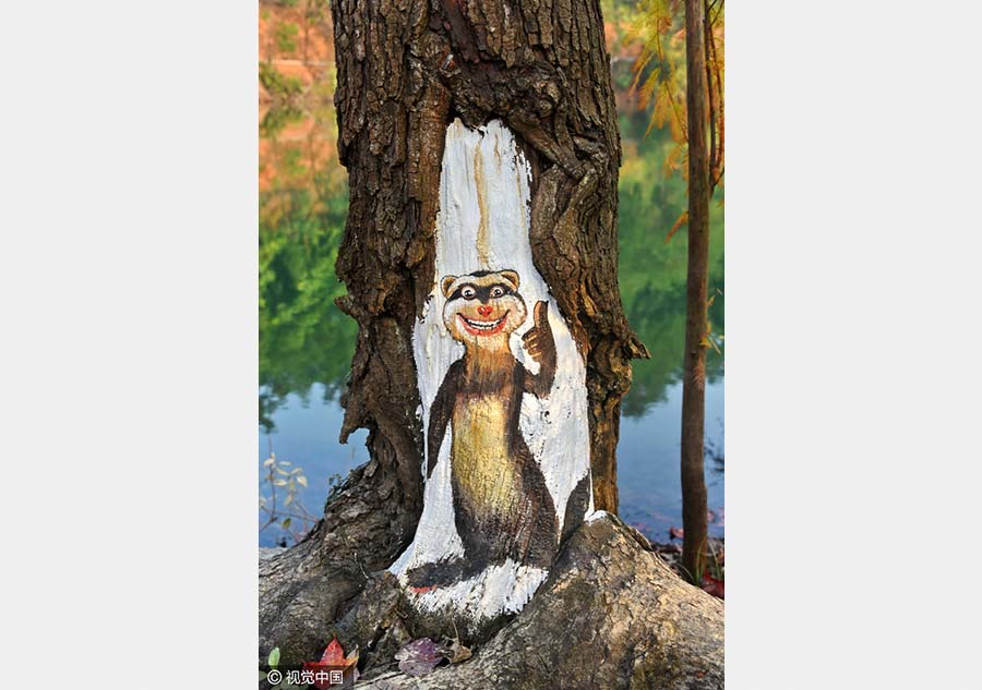 Paintings bring tree trunks to life