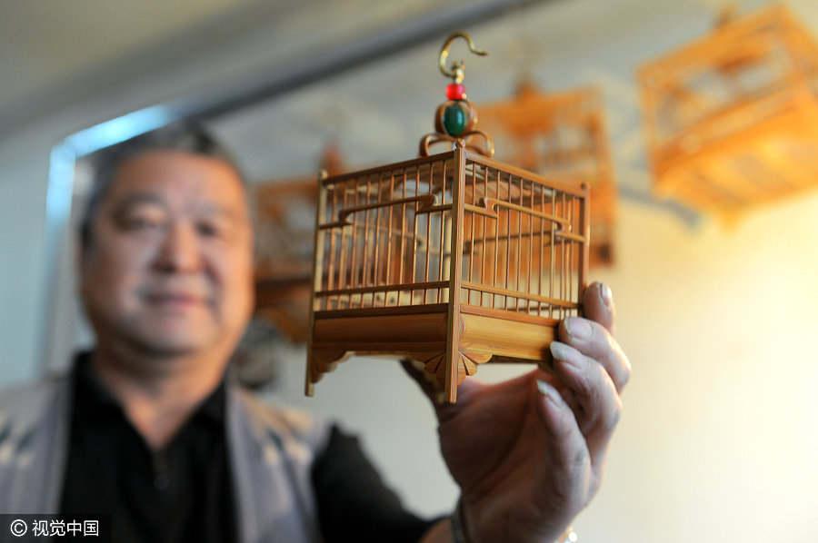 Folk artist dedicated to making bird cages