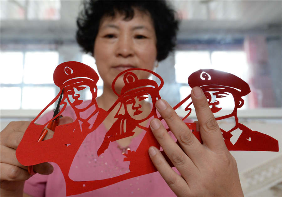 Artist creates paper-cuts to mark PLA's 90th anniversary