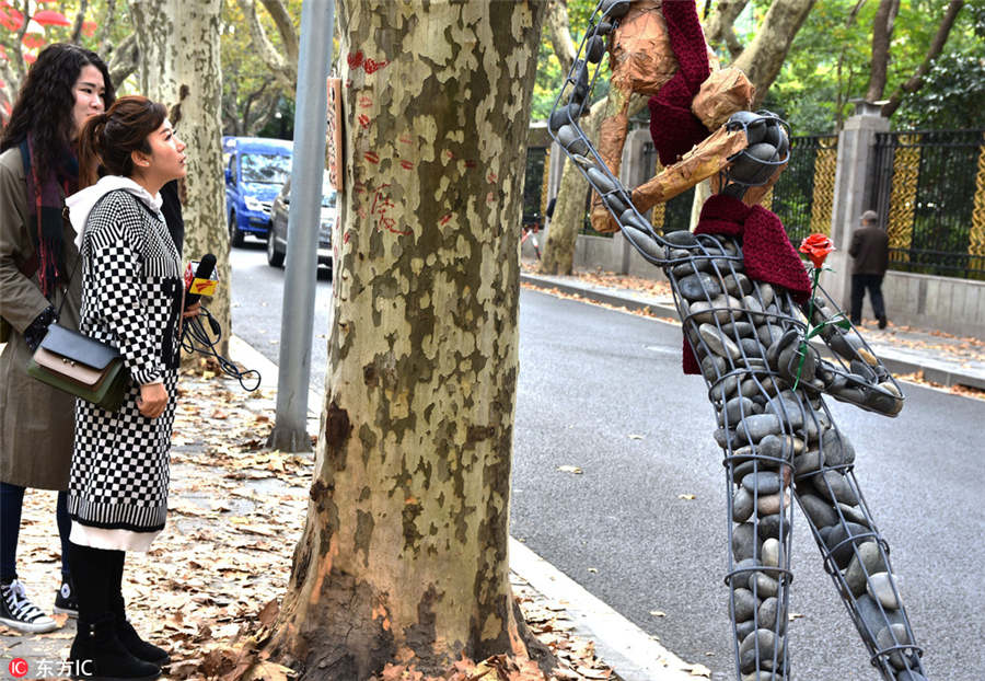 Shanghai stages street art exhibition on fallen leaves