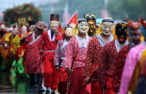 Folk artisan works on Nuo Opera masks