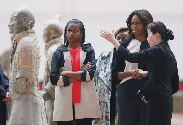 Obamas visit ancient guards, modern kids