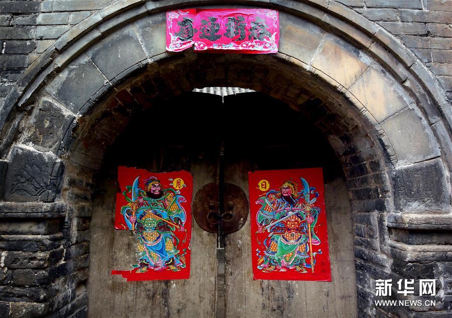 Pictures of door gods decorate homes after Little New Year