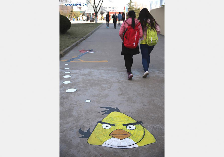 Cartoon figures painted on manhole covers in Shandong