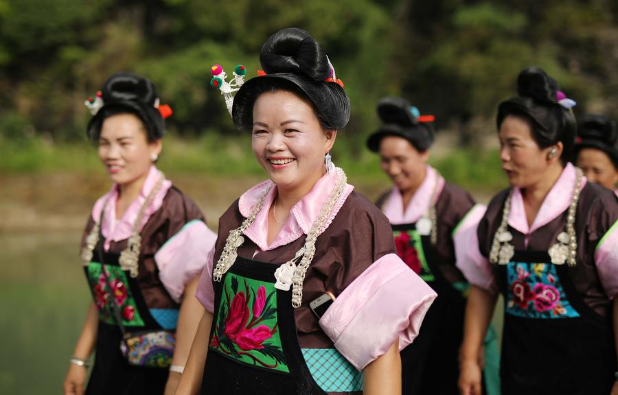 Miao people dance to celebrate 'Chixin Festival' in SW China's Guizhou