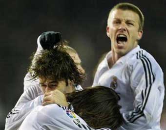 Real Madrid's soccer player Raul (R) and teammate Brazilian Ronaldo (L) celebrate after scoring a goal during their Spanish League football match at the Vicente Calderon stadium in Madrid. [AFP]