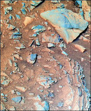 NASA's Mars Exploration Rover Spirit took this false-color image of the rock nicknamed 'Tetl' in 2004. One year after they landed on Mars and confirmed that water once flowed on the red planet, the US robot probes Spirit and Opportunity continue their relentless exploration for the origins of life, far surpassing their three-month mission expectancy. [AFP/file]