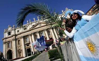 An Argentine waves a palm branch during the Palm Sunday mass led by Cardinal Camillo Ruini in Saint Peter's Square at the Vatican on March 20, 2005. For the first time in Pope John Paul's papacy, Holy Week services leading up to Easter began without the Pontiff on Sunday and the faithful heard a cardinal compare the Pope's suffering to that of Christ. [Reuters]