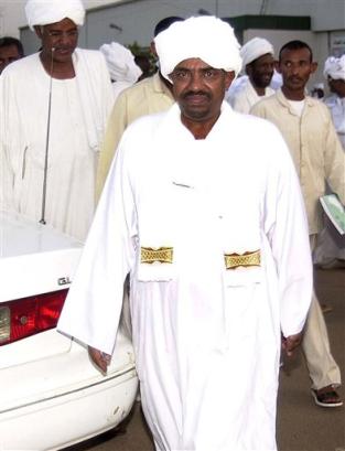 Sudanese head of state General Omar Al-Bashir leaving the closed door meeting of the ruling National Congress Party, at the party's headquarters in Khartoum, Friday, April 1, 2005. Sudanese hard-liners vowed Friday to defy a U.N. Security Council resolution referring Darfur war crimes suspects to the International Criminal Court, saying it was unfair for Sudanese suspects to face The Hague tribunal when Americans are exempt. Sudan opposes sending any of its citizens accused of committing war crimes during the 2-year-old Darfur conflict in the country's west to a foreign court, saying Sudan's judicial system will take charge of any such prosecutions. Two unidentified members of the party at left. (AP Photo/Abd Raouf)