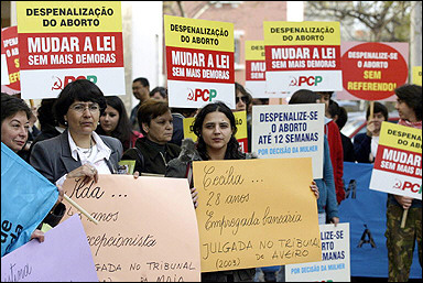 Pro-choice demonstrators demand changes to the law that forbids abortion, outside the court in Setubal. The trial of three women accused of violating Portugal's strict rules against abortion was suspended again after a defense lawyer complained the judge was biased.(AFP/File/Francisco Leong)