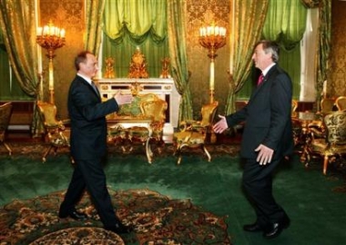 Russian President Vladimir Putin, left, welcomes Luxembourg Prime Minister Jean-Claude Juncker, whose country holds the EU's rotating presidency, at the Russia-EU Summit in the Moscow Kremlin, Tuesday, May 10, 2005. Putin and European Union leaders on Tuesday unveiled a wide-ranging partnership accord that aims to deepen ties between Moscow and the 25-member bloc, especially in the economic sphere. (AP