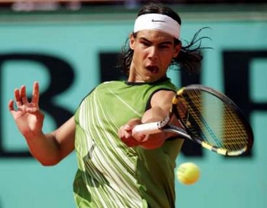 Fourth seed Rafael Nadal of Spain returns a forehand during his match against Frances Sebastien Grosjean, the number 23 seed, in the fourth round of the French Open tennis tournament at the Roland Garros stadium May 30, 2005. Nadal won 6-4 3-6 6-0 6-3. REUTERS