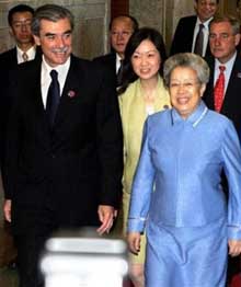 Chinese Vice Premier Wu Yi, right and U.S. Commerce Secretary Carlos Gutierrez, left, walking to a meeting of the U.S.-China Joint Commission on Commerce and Trade, (JCCT) in Beijing, China, Monday, July 11, 2005.