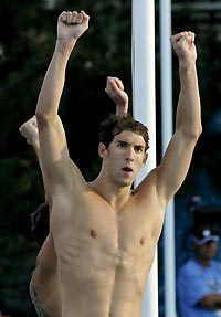 American swimmer Michael Phelps celebrates his team's gold medal victory in the men's 4 x 100m freestyle relay at the World Swimming Championships in Montreal July 24, 2005. The U.S. took gold with a time of three minutes 13.77 seconds, with Canada taking silver and Australia bronze.