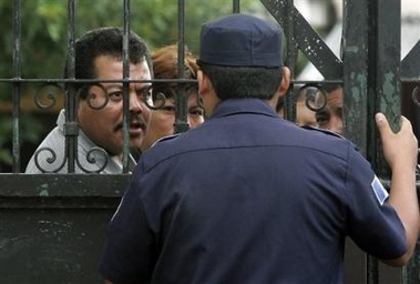 Relatives of prisoners who died during a prison riot at the Pavon Prison on Monday look for information at the morgue in Guatemala City, Tuesday, Aug. 16, 2005. 