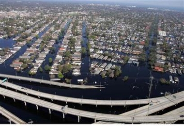 Homes surrounded by floodwaters from Hurricane Katrina near I-10 are seen in this aerial view in New Orleans September 7, 2005. 