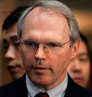 Christopher Hill, U.S. Assistant Secretary of State for East Asian and Pacific Affairs and top U.S. negotiator for the six-party talks, listens to a question from a journalist after talks in Beijing September 15, 2005. [Reuters]