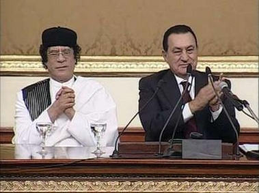 A video grab shows Egyptian President Hosni Mubarak (R) applauding visiting Libyan leader Muammar Gaddafi in parliament in Cairo, September 27, 2005. 